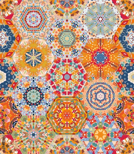 Bright seamless patchwork design from colorful hexagonal patterns. Print for fabric, textile, carpet, rug.