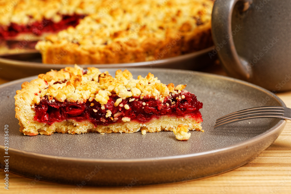 Closeup piece of homemade cherry pie on wooden table. Shallow focus. Closeup piece of homemade cherry pie on wooden table. Shallow focus.