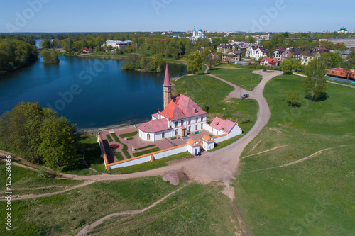 The ancient Priory palace in the cityscape on a sunny May day (aerial photography). Gatchina, Russia