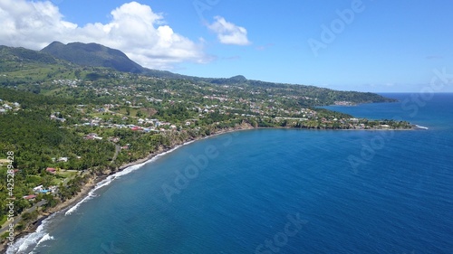 Black sand beach in Guadeloupe aerial view © Michael