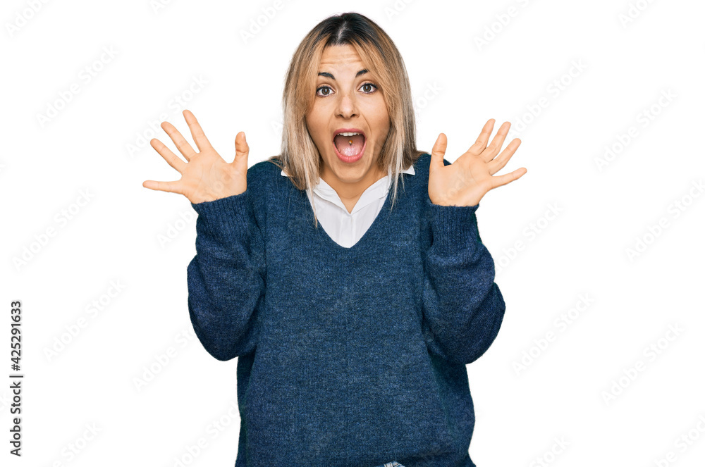 Young caucasian woman wearing casual clothes celebrating crazy and amazed for success with arms raised and open eyes screaming excited. winner concept Young caucasian woman wearing casual clothes celebrating crazy and amazed for success with arms raised and open eyes screaming excited. winner concept