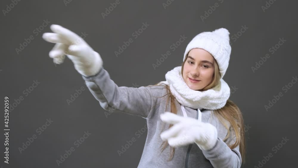 Funny unusual girl having fun, smiling, dancing in the studio on a gray background. Funny unusual girl having fun, smiling, dancing in the studio on a gray background.