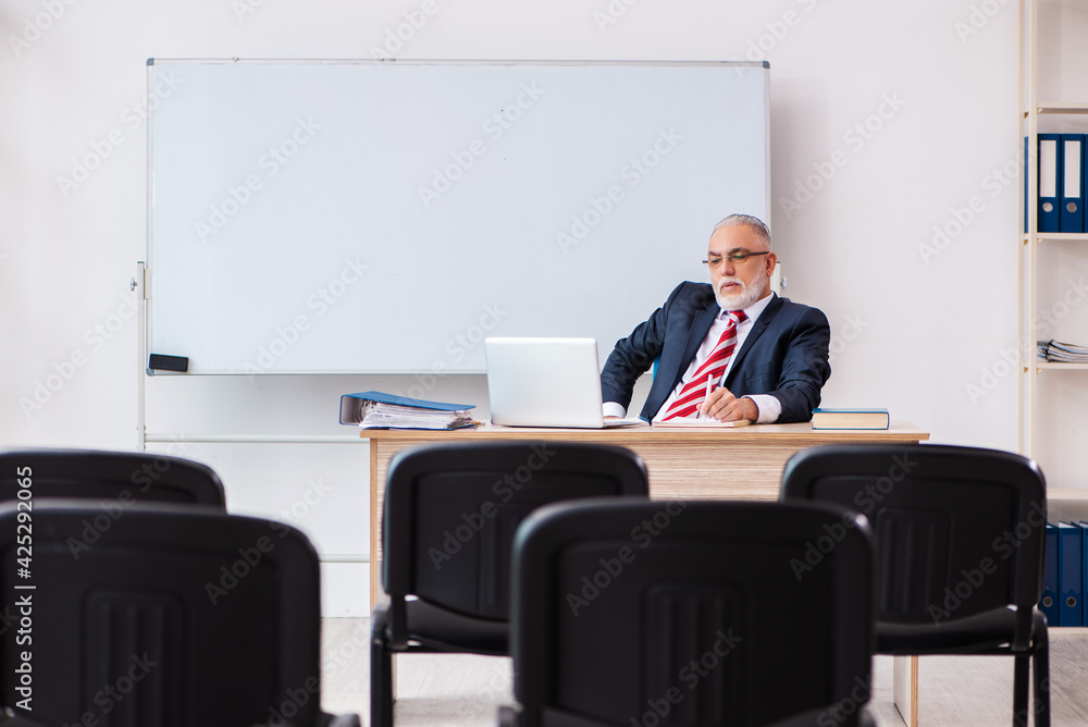 Old male business couch in the classroom during pandemic Old male business couch in the classroom during pandemic