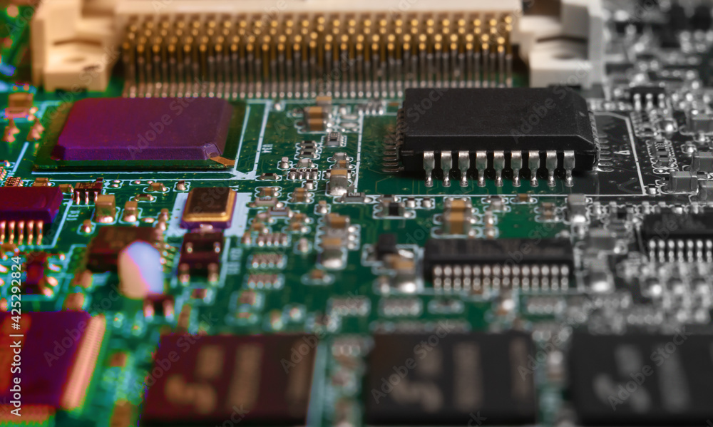 printed circuit board with surface mounted passive and active circuit components close up printed circuit board with surface mounted passive and active circuit components close up