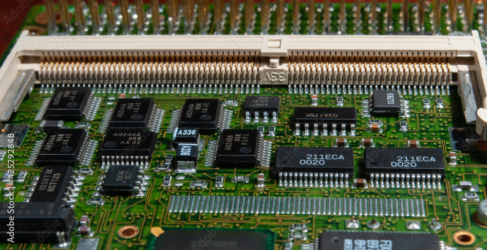 printed circuit board with surface mounted passive and active circuit components close up printed circuit board with surface mounted passive and active circuit components close up