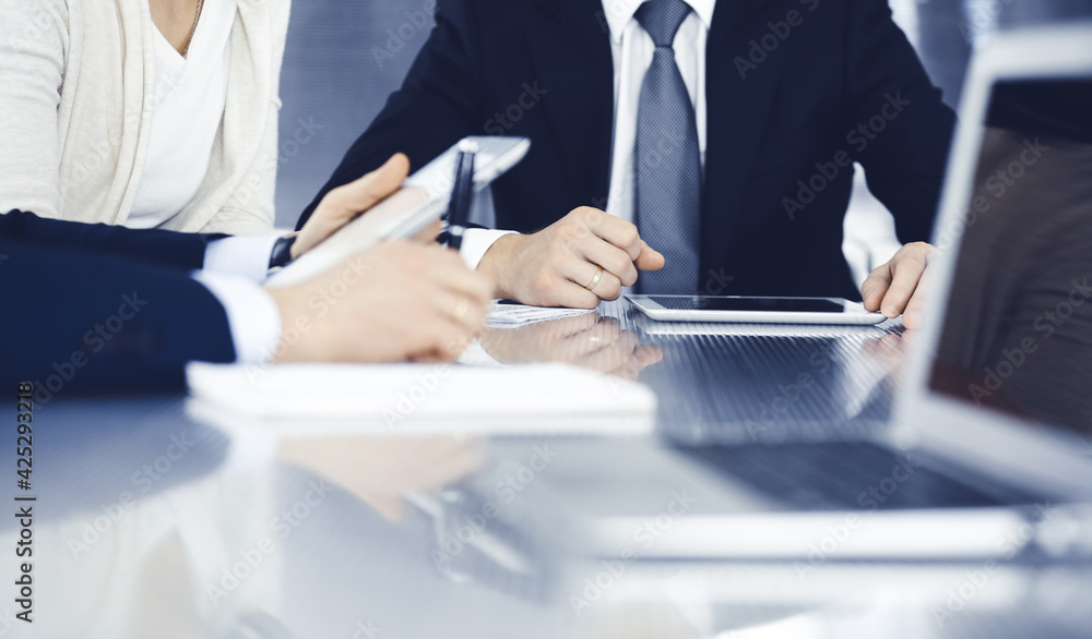 Business people working together at meeting in a modern office. Unknown businessman and woman with colleagues or lawyers at negotiation about contract Business people working together at meeting in a modern office. Unknown businessman and woman with colleagues or lawyers at negotiation about contract