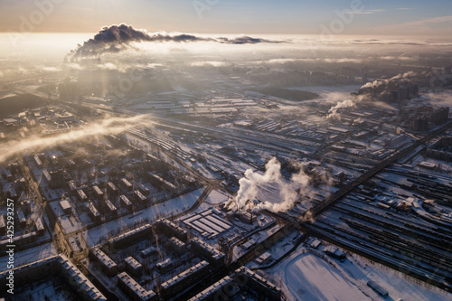 Winter city in the clouds from a drone