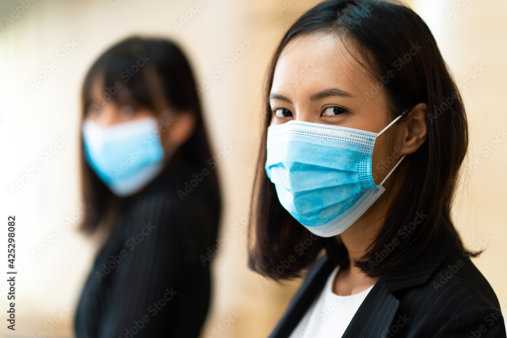 Peoples wear face surgical mask during coronavirus and flu outbreak. Virus and illness protection, hand sanitizer in public crowded place Peoples wear face surgical mask during coronavirus and flu outbreak. Virus and illness protection, hand sanitizer in public crowded place