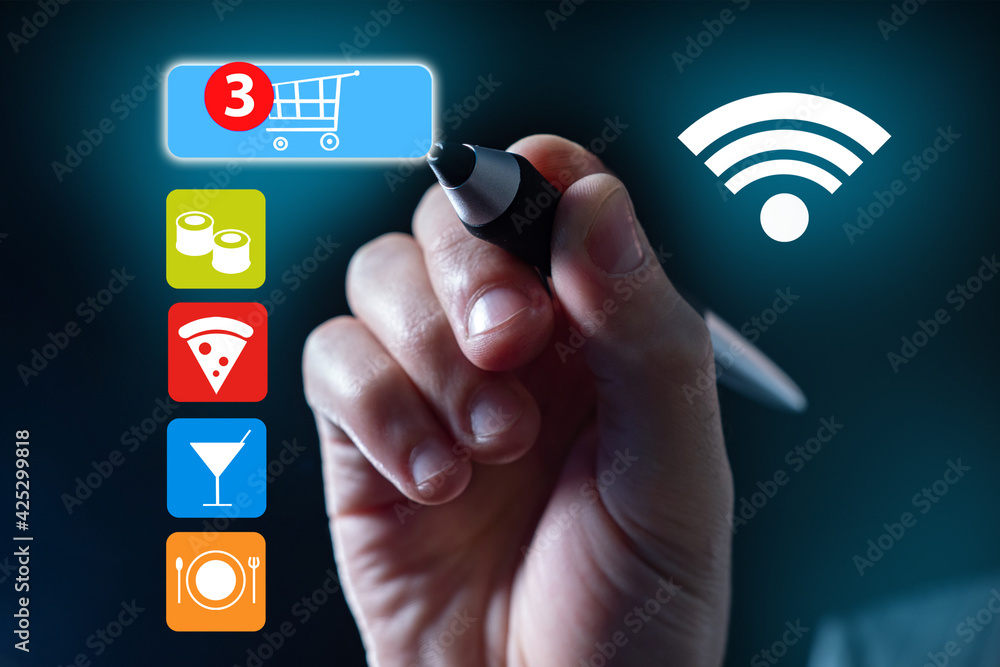 Order foods online from app. App food concept. Fast food delivery. Concept - illustration with food icons. Man hand clicks on a shopping cart icon. Person makes order from a restaurant via Internet Order foods online from app. App food concept. Fast food delivery. Concept - illustration with food icons. Man hand clicks on a shopping cart icon. Person makes order from a restaurant via Internet