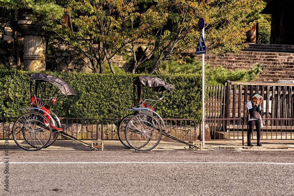 Kyoto, Japan - 22 Oct 2012: Root car of Kyoto people, Japan. Waiting for tourists with root people. Kyoto, Japan - 22 Oct 2012: Root car of Kyoto people, Japan. Waiting for tourists with root people.