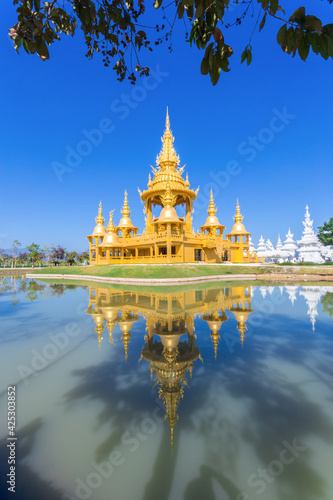 Gold pagoda in Wat Rong Khun or White Temple, Thailand. © gamjai
