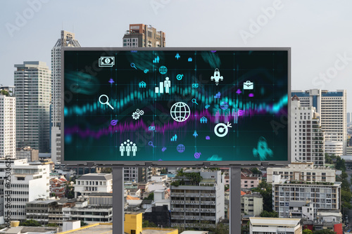 Research and development hologram on billboard over panorama city view of Bangkok. The hub of new technologies to optimize business in Southeast Asia. Concept of exceeding opportunities.