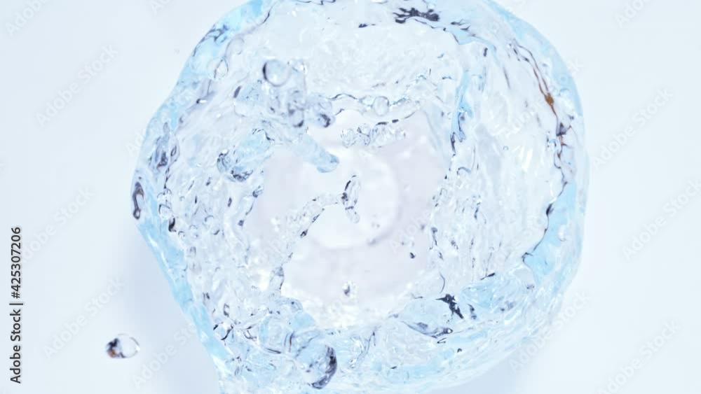 Super Slow Motion Shot of Water Vortex Splash Isolated on Light Blue Background at 1000fps. Super Slow Motion Shot of Water Vortex Splash Isolated on Light Blue Background at 1000fps.
