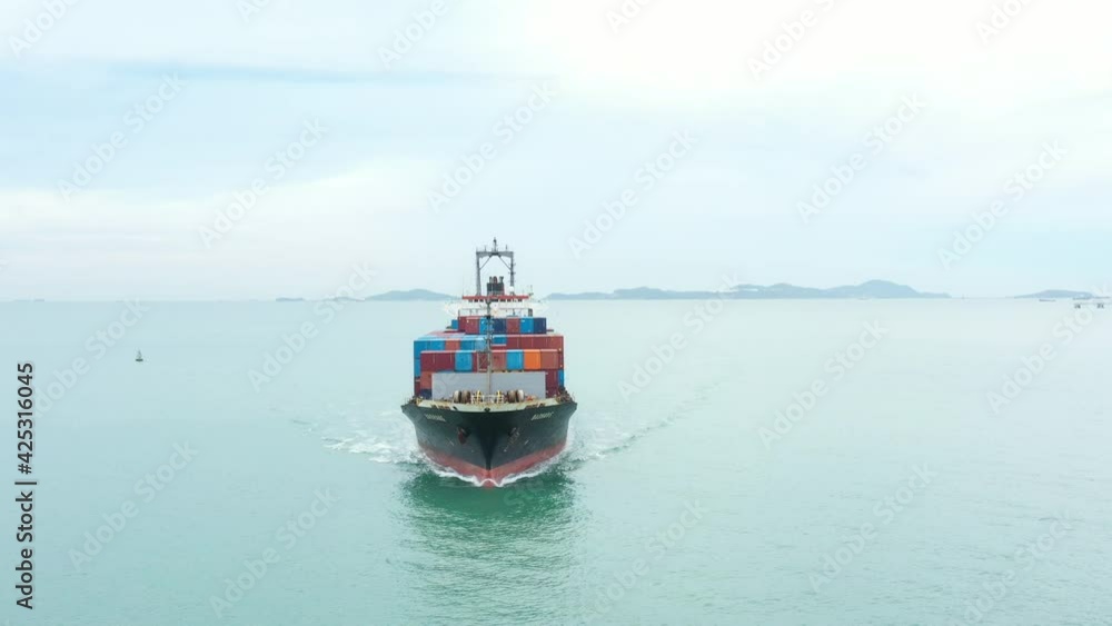 Aerial view of cargo ship carrying container for business import and export Aerial view of cargo ship carrying container for business import and export