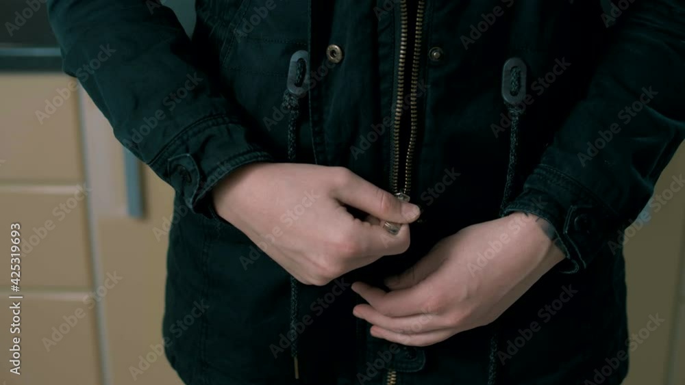 Girl unzips and zips the jacket. Girl unzips and zips the jacket.