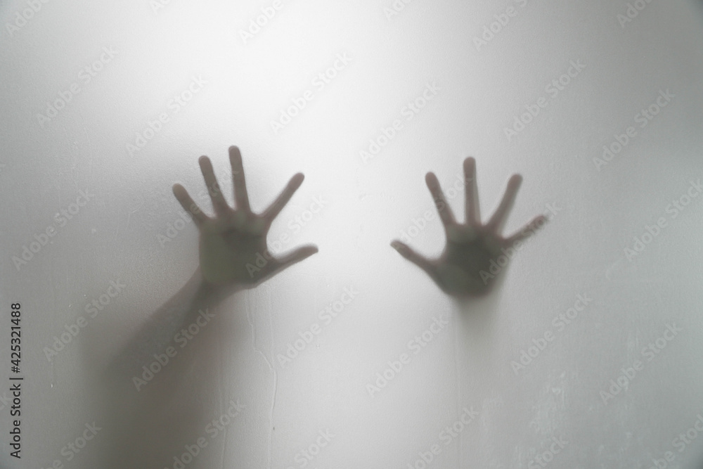 shadow of the right hand and left behind the glass is wet. shadow of the right hand and left behind the glass is wet.