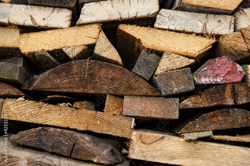 фотографія wood trimming stacked for storage, countryside.