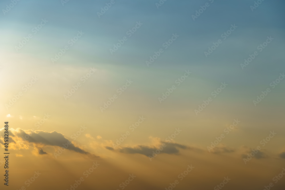 beautiful sunset sky time lapse, bright sunlight and silhouette of clouds as a background