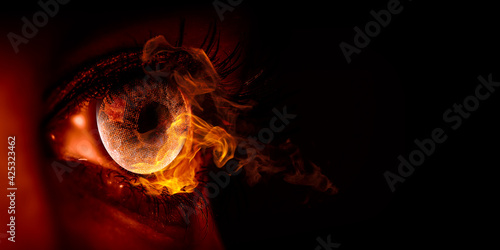 Macro image of human eye with fire flames © Sergey Nivens