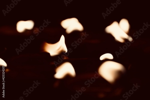 Burning oil lamps in the dark. Oil lamps lightened up during the festival at India. Lamps fired at ancient temple in Tamilnadu.