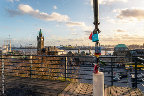 Love locks at the landing stages in St. Pauli, Hamburg. Sunset over the harbor. photo