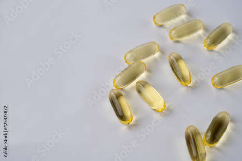 omega 3 and vitamins on white background