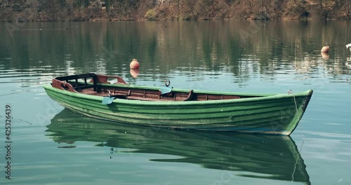 Old Wooden Boat On Lake Zbilje in Slovenia. photo