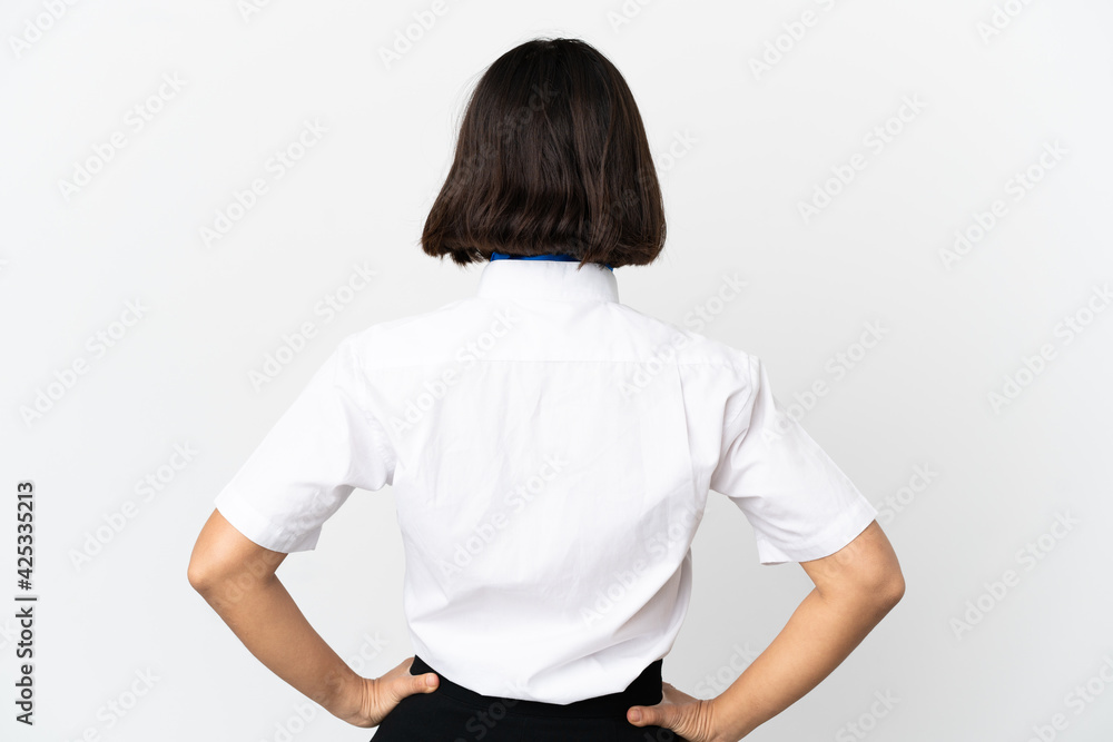 Fototapeta premium Airplane stewardess over isolated background in back position