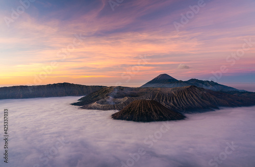 Bromo volcano mountain at sunrise in East Java, Indonesia surrounded by morning fog.