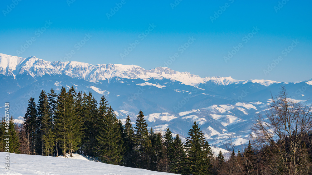 Snowy mountain landscape of Bucegi mountains in Romania