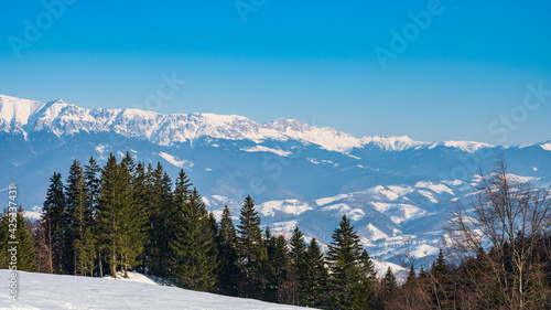 Fototapeta Naklejka Na Ścianę i Meble -  Snowy mountain landscape of Bucegi mountains in Romania