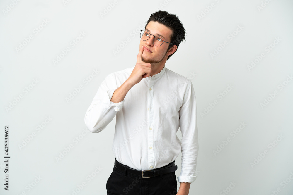 Russian Business man isolated on white background having doubts while looking up Russian Business man isolated on white background having doubts while looking up