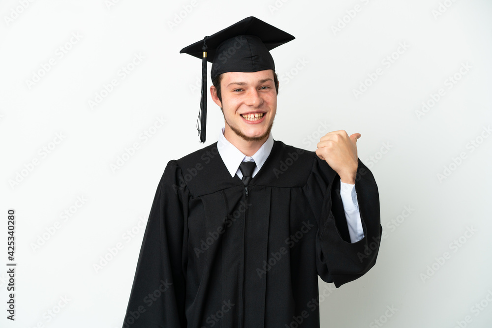 Young university Russian graduate isolated on white background pointing to the side to present a product Young university Russian graduate isolated on white background pointing to the side to present a product
