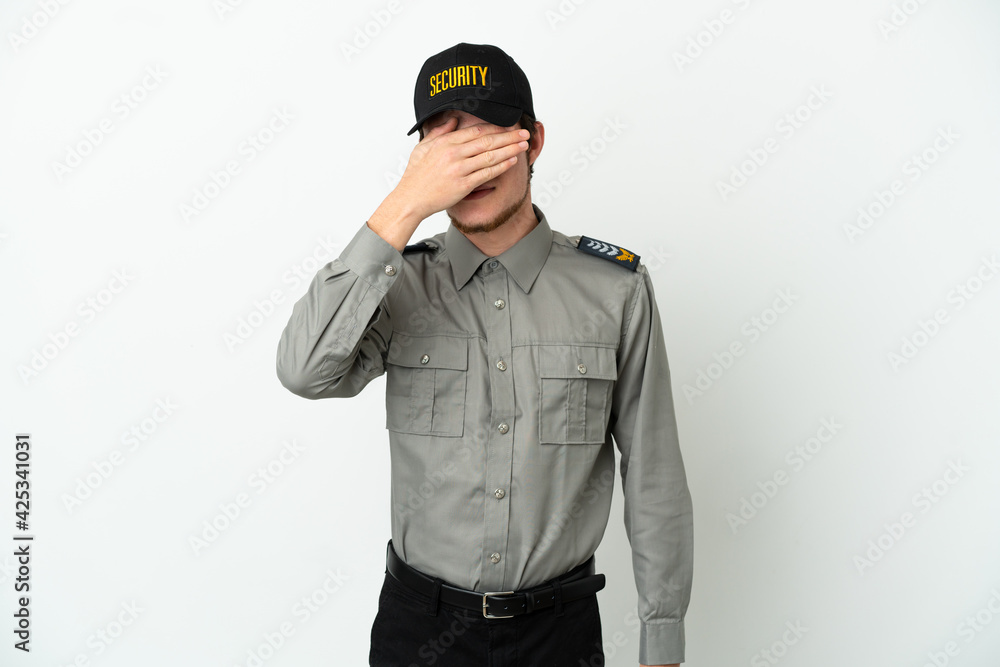 Young Russian security man isolated on white background covering eyes by hands. Do not want to see something Young Russian security man isolated on white background covering eyes by hands. Do not want to see something