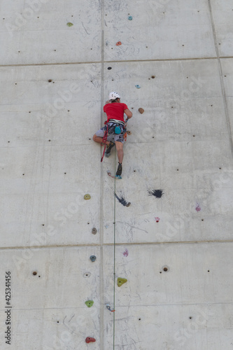 Climber training on vertical wall in a climbing wall. Lifestyle