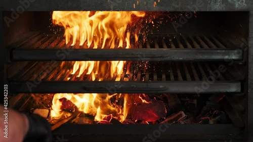 Flames and embers in the grill oven. Burning coals in a professional grill oven, flame in a josper. Grilled fire. Fire charcoal.