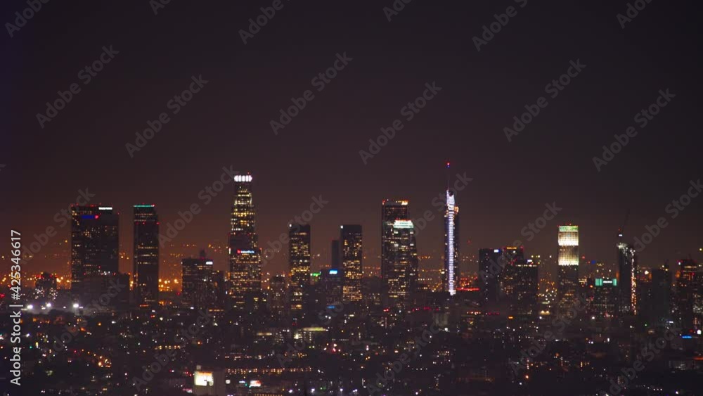 LA: Downtown LA skyscrapers closeup silhouette at night, shot form the Hollywood Hills - Los Angeles California, USA LA: Downtown LA skyscrapers closeup silhouette at night, shot form the Hollywood Hills - Los Angeles California, USA