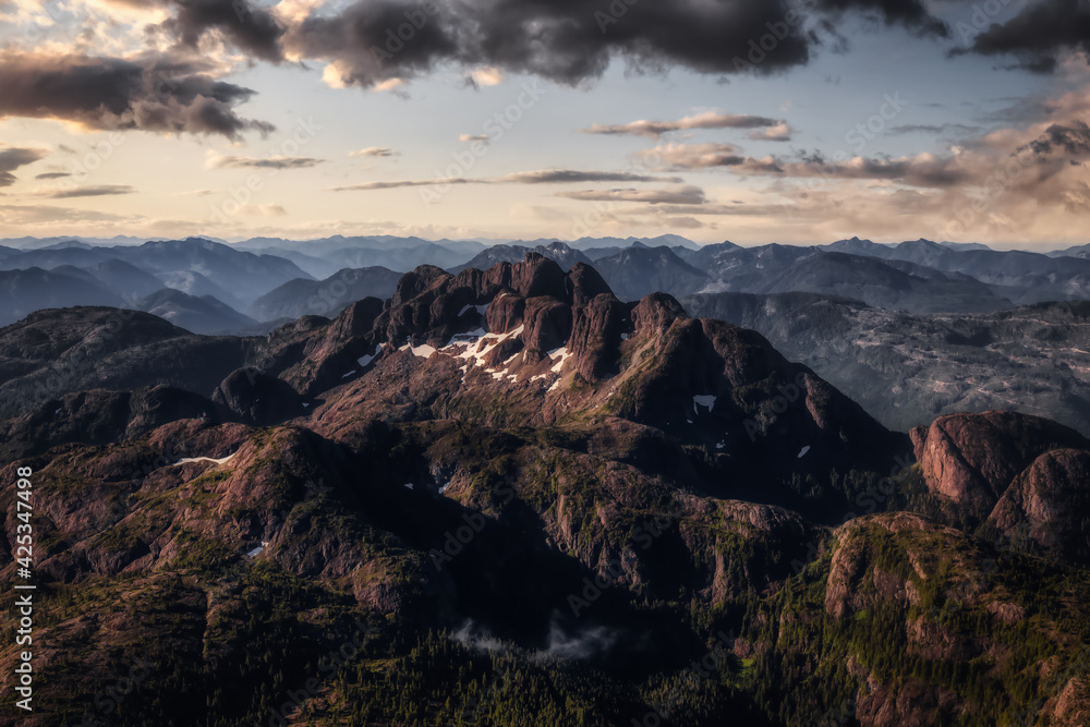 Mt Arrowsmith viewed from an aerial perspective. Taken in Vancouver Island, British Columbia, Canada, during a sunny summer morning. Sunrise Sky Dramatic Art Render.