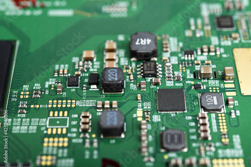Electronic components and processor on a printed circuit. Close-up of electronic components on a TV, computer board. Integrated circuit. Information engineering. Semiconductor. PCB. 