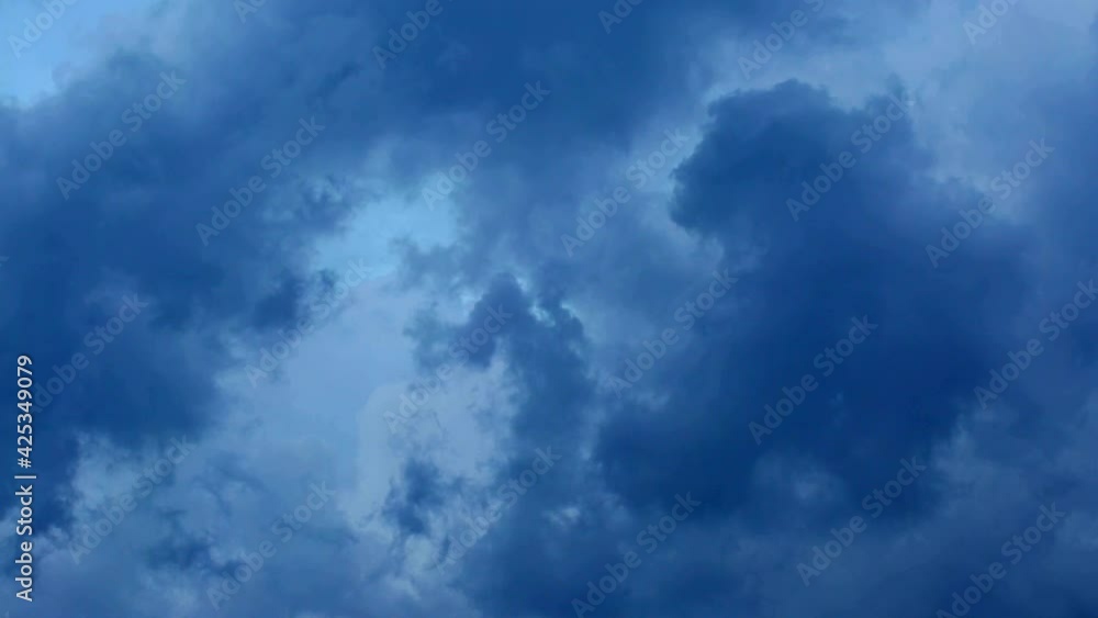 Atmospheric blue sky with textured storm clouds before rain and storm. Atmospheric blue sky with textured storm clouds before rain and storm.