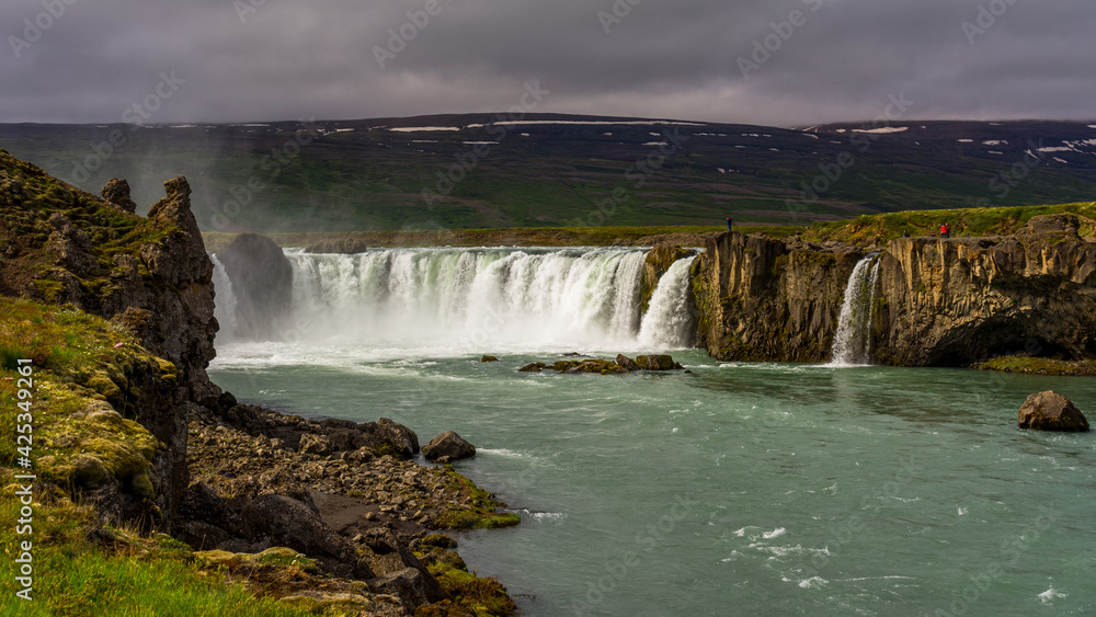View of the majestic Godafoss waterfall near the city of Akureyri during summer season