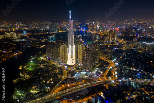 pic evening aerial panorama of Saigon  Ho Chi Minh City  Vietnam featuring all key buildings of the city skyline and the Saigon riverfront with beautiful light reflections on the calm water