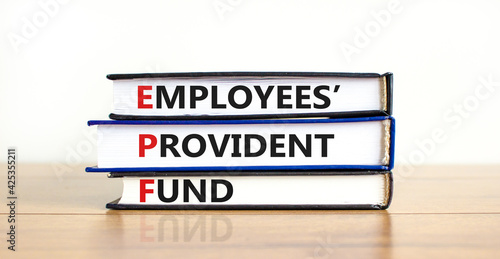 EPF, employees provident fund symbol. Books with words 'EPF, employees provident fund'. Beautiful white background, copy space. Business and EPF, employees provident fund concept. photo