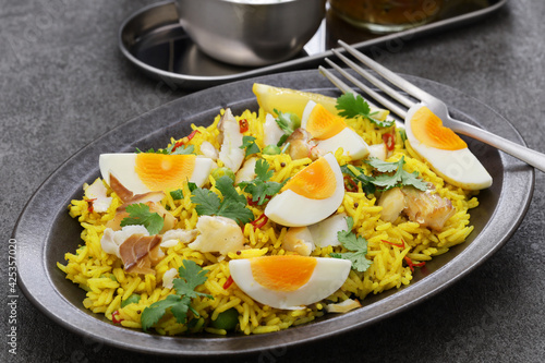 Kedgeree; spice rice with smoked haddock nad boiled eggs, homemade english breakfast photo