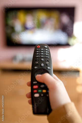 tv remote control in hand