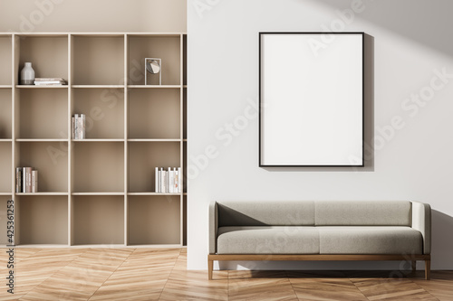 Beige living room interior with seat and bookshelf, mock up © ImageFlow