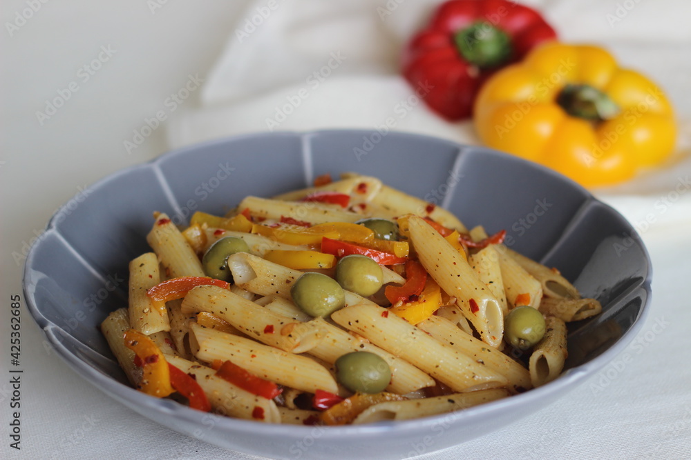 Butter pasta with vegetables. Boiled pasta sauteed in butter with garlic and oregano and tossed with olives and stir fried bell peppers. Butter pasta with vegetables. Boiled pasta sauteed in butter with garlic and oregano and tossed with olives and stir fried bell peppers.