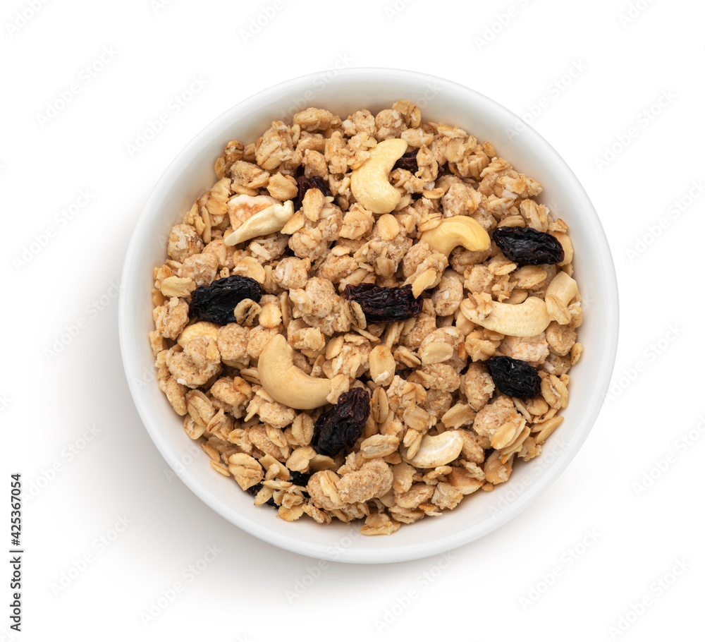 Bowl of granola, crunchy muesli with nuts, top view Bowl of granola, crunchy muesli with nuts, top view