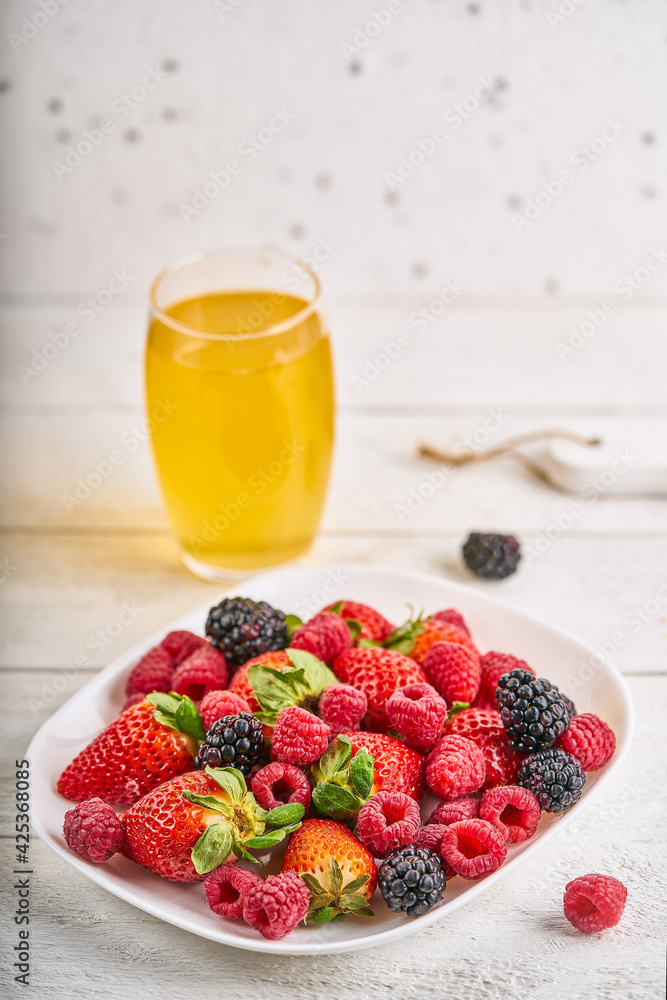 glasses with drink and berries on a rustic background. High quality photo glasses with drink and berries on a rustic background. High quality photo