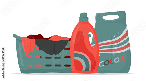 Laundry basket with dirty clothes, detergent and washing powder on the table